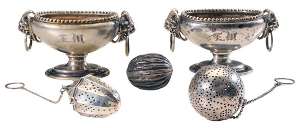 Five Pieces Sterling, Salts, Tea: Balls, Nutmeg American, 19th/20th century: pair open salts with horned mask-and-ring handles, bead borders, no maker's mark, 2-1/2 x 4-1/2 in.; two tea balls, one urn form and one round; nut-form nutm