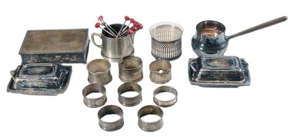 Seventy-One Silver-Plated Items: small spittoon; bottle opener/jigger; napkin rings (one set of six); pipkins; creamer; pearl-handle knives; carving set; fish set; bottle-form pepper grinder and salt; box; spoons, losses to plate, we