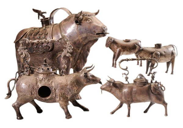 Five Silver Cow-Form [Aquamanile]: Peruvian, three with handles, largest with coin decoration, low-grade silver or silver plate, 3-3/4 in. to 13 in., wear, repair Provenance: Private Collection, Asheville, North Carolina