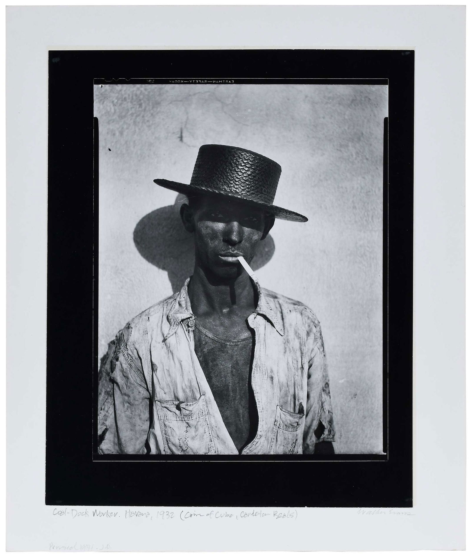 Walker Evans: (American, 1903-1975) Coal Dock Worker, Havana, Cuba, from The Crime of Cuba, 1933, signed in pencil on mount lower right "Walker Evans", inscribed in pencil on mount lower left "Coal Dock Worker, Hav