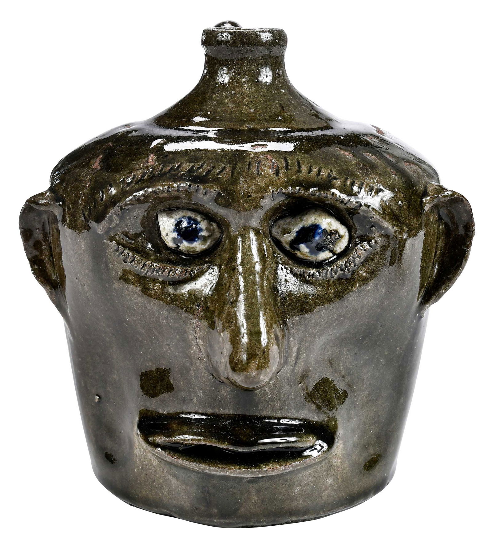 Important Early Lanier Meaders Astonished Stoneware Face Jug: (Mossy Creek, White County, Georgia, 1917-1998) circa 1968, short wide jug form, modified runny green crackle alkaline glaze, inset kaolin eyes, cobalt pupils, applied facial features including protru