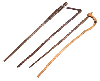 Four Georgia Carved Wood Canes