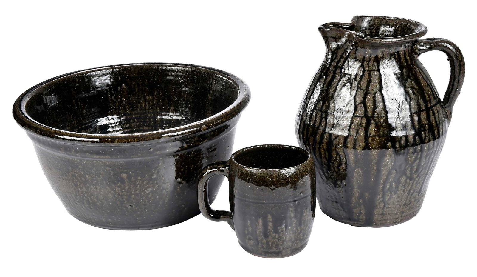 Three Pieces of Lanier Meaders Georgia Stoneware: (Mossy Creek, White County, Georgia, 1917-1998) pitcher with green glaze runs over brown and yellow speckled ash glaze, angular tapered body, curved strap handle, flared rim, pinched spout, 10 in.; de