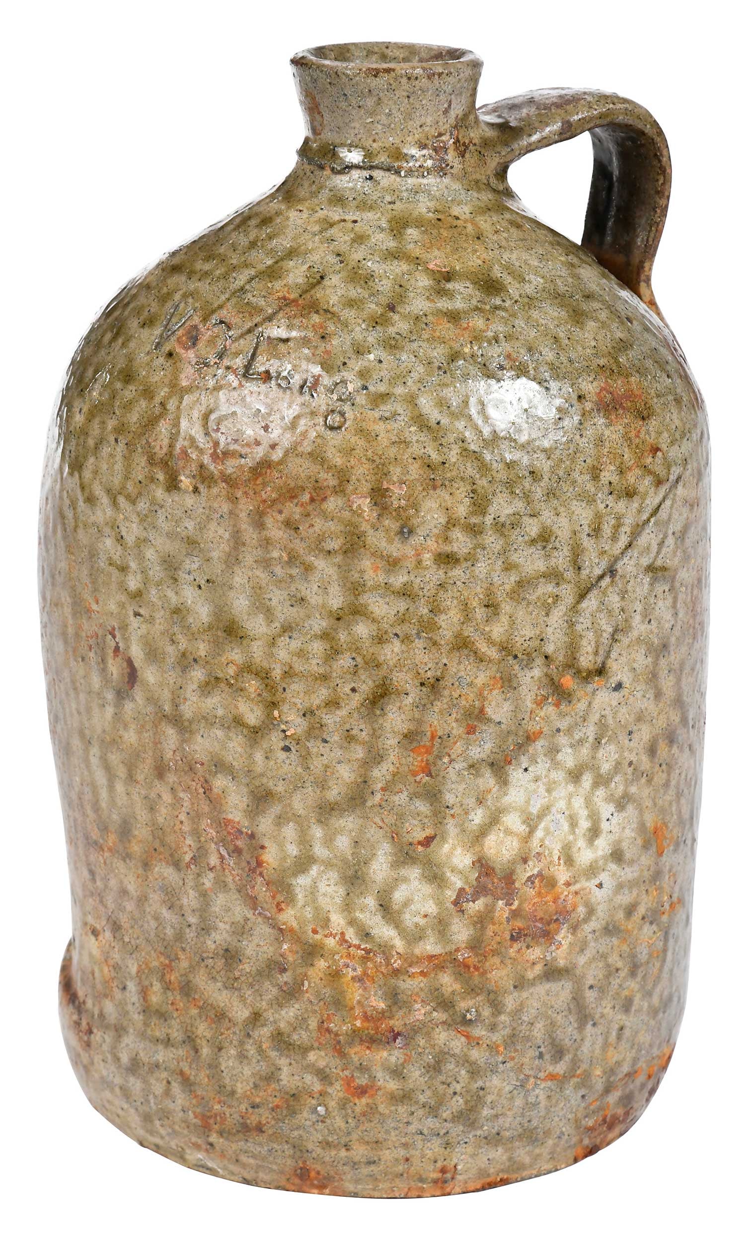 Scarce Virgil Oscar Long Crawford County Georgia Stoneware Jug: (Crawford County, Georgia, circa 1890s) cylindrical jug form, runny mottled alkaline ash glaze, rounded shoulder inscribed "V.O. Long", small tight flat strap handle, short flared spout, 9-1/2 in. Pro