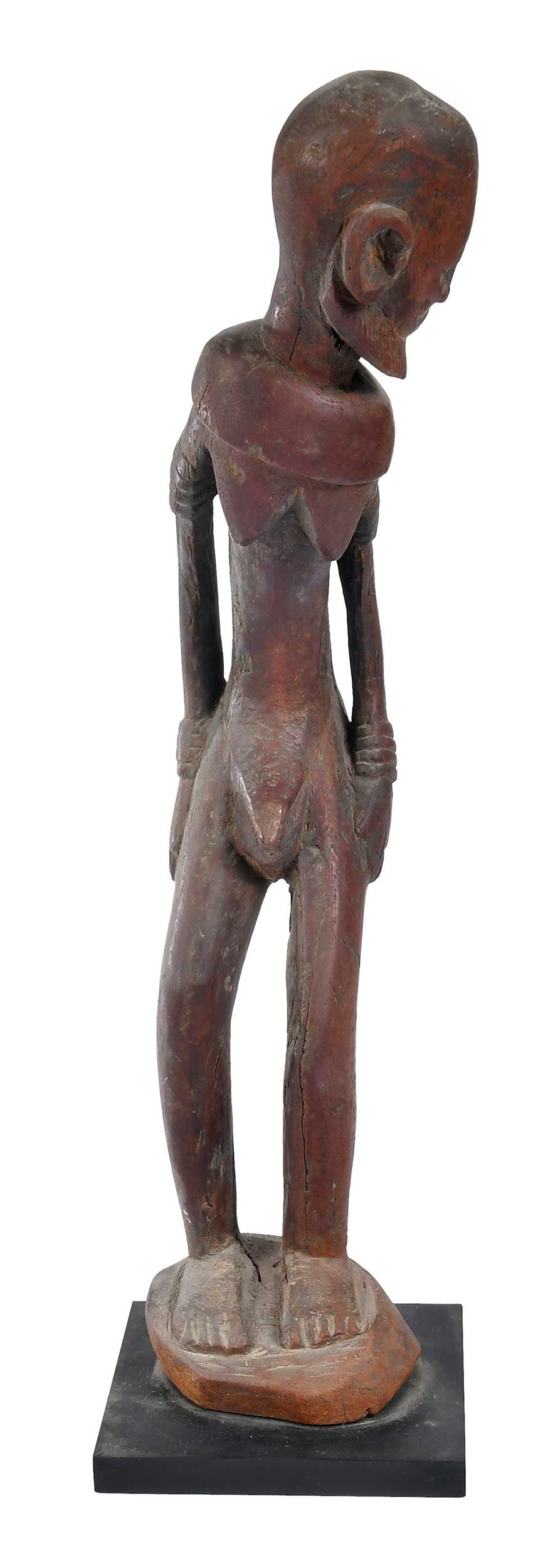 Dogon Nude Standing Hermaphrodite Figure: Mali, late 19th/20th century, wood on laminate base, figure 22-3/4 x 6-1/2 x 7-1/2 in., with base 23-1/4 x 6-1/2 x 7-1/2 in. Provenance: Xanadu Gallery, San Francisco, California, 1985, $865