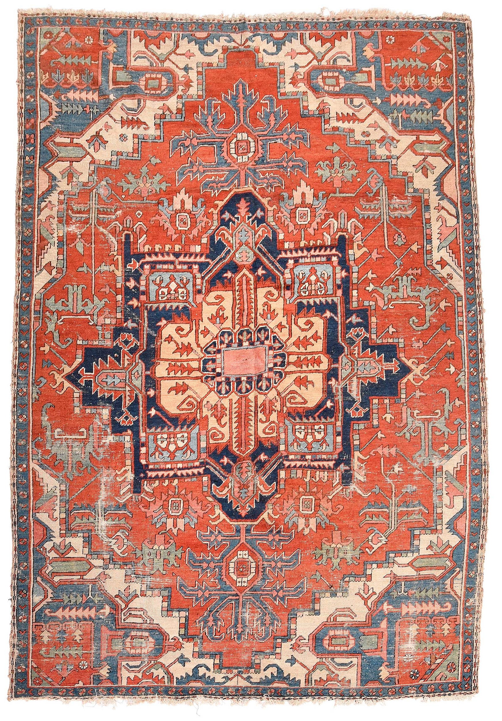 Heriz Carpet: early 20th century, polygonal medallion, red field, geometric leafy trailing vines, 10 ft. 6 in. x 7 ft. 8 in. Provenance: Private Collection, Atlanta, Georgia