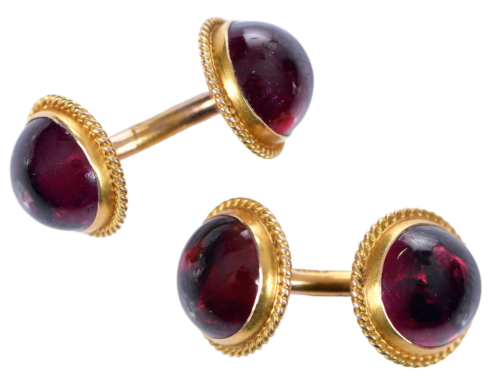 14kt. Garnet Cufflinks: four bezel set garnet cabochons, approx. 7.30mm diameter, stamped "14" 14kt. yellow gold, 3/4 in. length, 4.0 g Provenance: Private Collection Note: Brunk Auctions makes no warranty or guarantee whats
