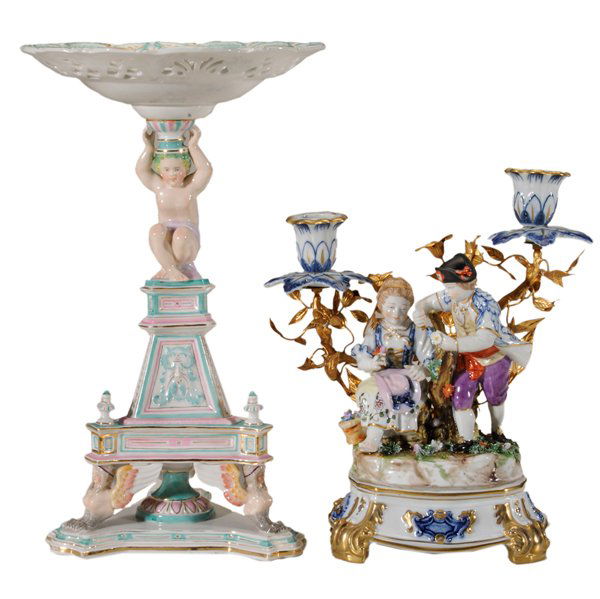 Egyptian Revival Porcelain Tazza,: Capodimonte Figural Candelabra Continental, 20th century: tazza with shallow bowl and reticulated border, [putto] support over triangular base with winged female griffins, indistinct blue mark, 13-1/4