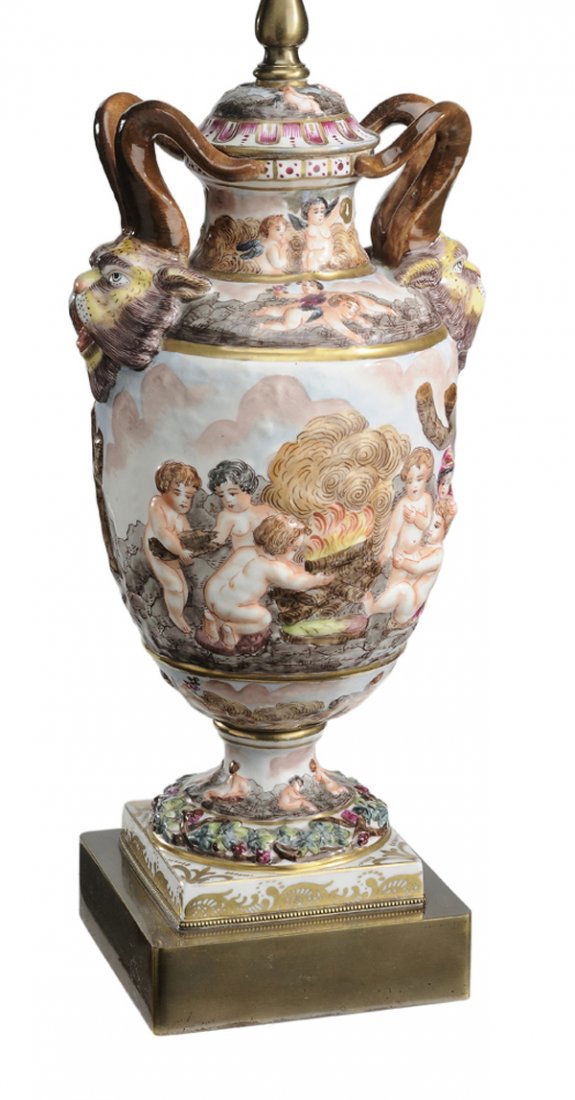 Capodimonte Porcelain Urn-Form Lamp: Continental, late 19th/early 20th century, urn with horned mask handles, brass base, mounted as lamp, 13-3/4 in., 28-1/2 in. with silk shade, good condition. Provenance: Property of a Tennessee Collec
