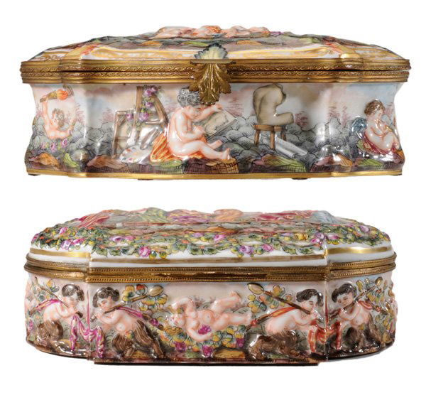 Two Brass-Mounted Capodimonte Boxes: Continental, 20th century: both cartouche shaped, one with [putti] in various pursuits including musicians and writers, 10-1/2 in.; one with classical women in outdoor beauty salon, 8-1/2 in., both in