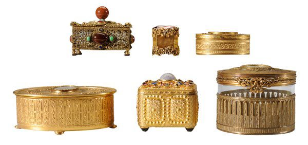 Six Lidded Jewelry Caskets: Continental, late 19th and 20th century: one circular with clear glass bottom, gilt brass top with hand-painted watercolor portrait of woman, 3-1/2 in.; one oval gilt metal, base marked "Apollo", 6 in
