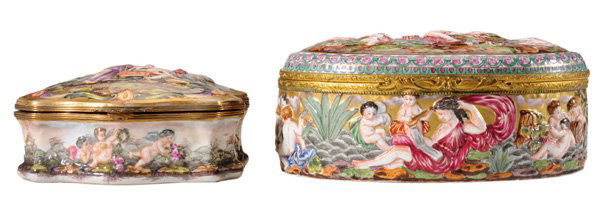 Two Capodimonte Boxes: Continental, 20th century, brass mounts: one oval with female figure with seven cupid attendants, interior painted with floral bouquets, 10 in.; one cartouche-shaped with female figure bathing, 7-3/8