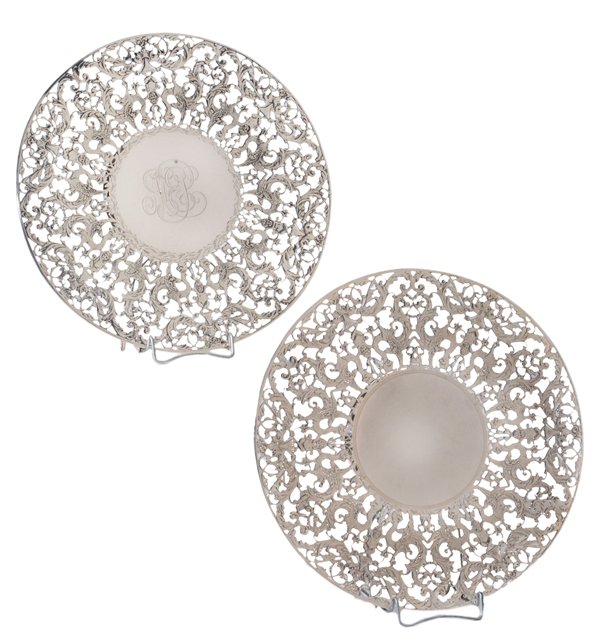 Two Similar Sterling Cake Plates: American, 20th century, openwork with griffins, [putti,] dolphins and scroll decoration, marks for Roger Williams Silver Co. (Providence, Rhode Island, circa 1900-1913), 5375, no monogram, 32.25 oz.T.