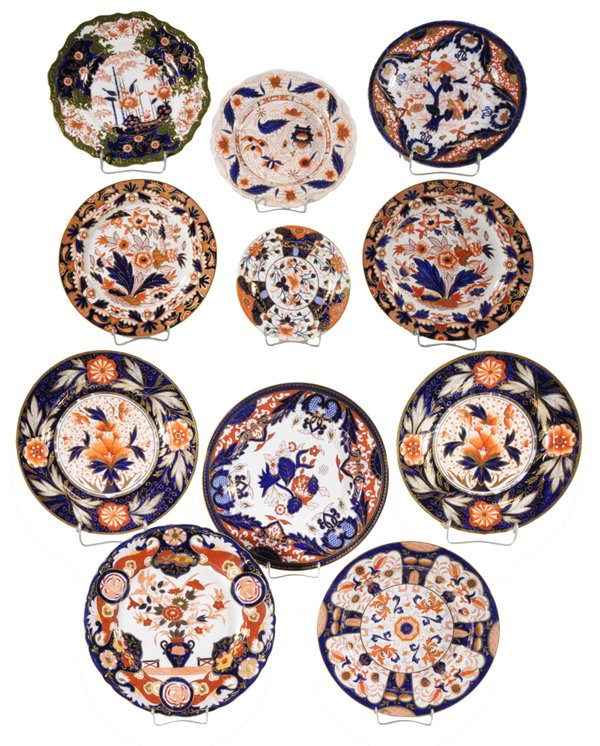 Eleven Imari Style Plates: British, late 19th and 20th centuries: pair marked "Booths Rajah", 8-3/8 in.; two 10 in., [one with small star crack verso;] one with vase of flowers and marked "Masons Ironstone" with puce mark, 10-1