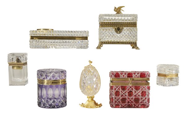 Seven Cut Glass Dresser: Boxes French, late 19th/20th century, all with gilt brass mounts, rectangular, heart-shaped, egg-shaped, one with cigar lighter, one with clock, one with bird finial, one amethyst cut to clear, one cr