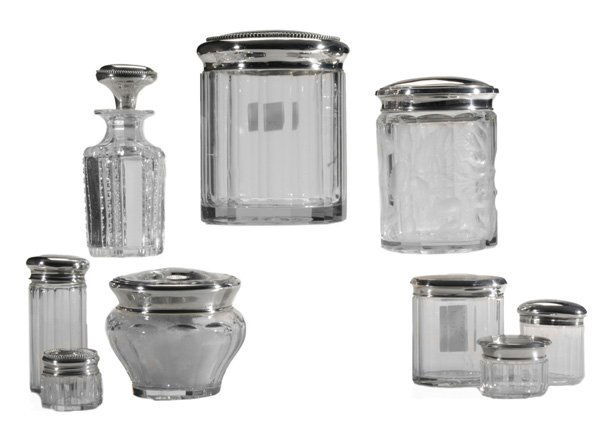 Nine Sterling and Glass Dresser Jars: American, 20th century, paneled and cut glass jars, one with intaglio rose decoration, powder jar with down puff; most lids with bead or engine-turned decoration, most with monogram, 1-3/4 in. to 6-1/