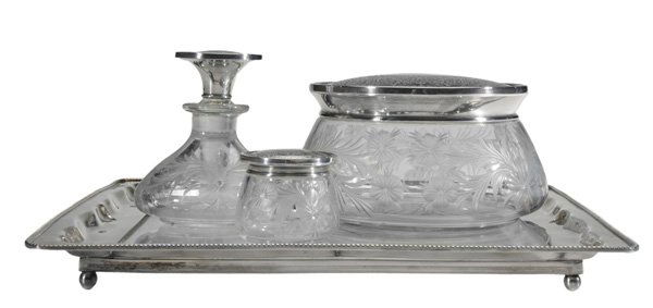 Sterling and Glass Dresser Jars, Tray: American, 20th century: set of three pieces with matching sterling lid with ornate scroll decoration including powder, perfume and pin jar, glass with intaglio floral decoration, marks for Meriden Bri