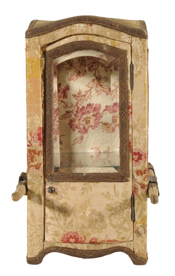 Upholstered Miniature Sedan Chair: Vitrine French, late 19th century, with brown velvet upholstered top, body overall upholstered in beige and red floral silk, three sides with inset beveled glass clear plates, hinged door at front ope