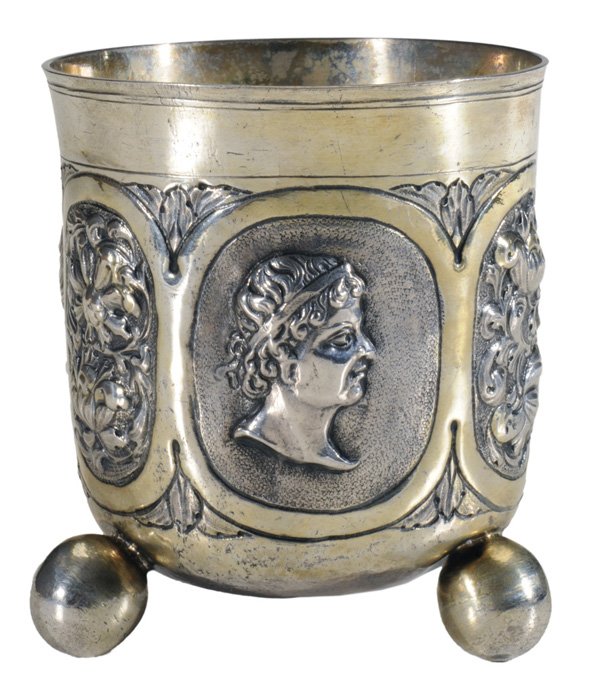 18th Century German Silver Beaker: probably Nuremberg, Germany, six panels with bust and floral relief, ball feet, gilt, no monogram, tests .900 or better, 5.22 oz.T., 4 in., two feet pushed in, loss to gilt, light scratches, small den