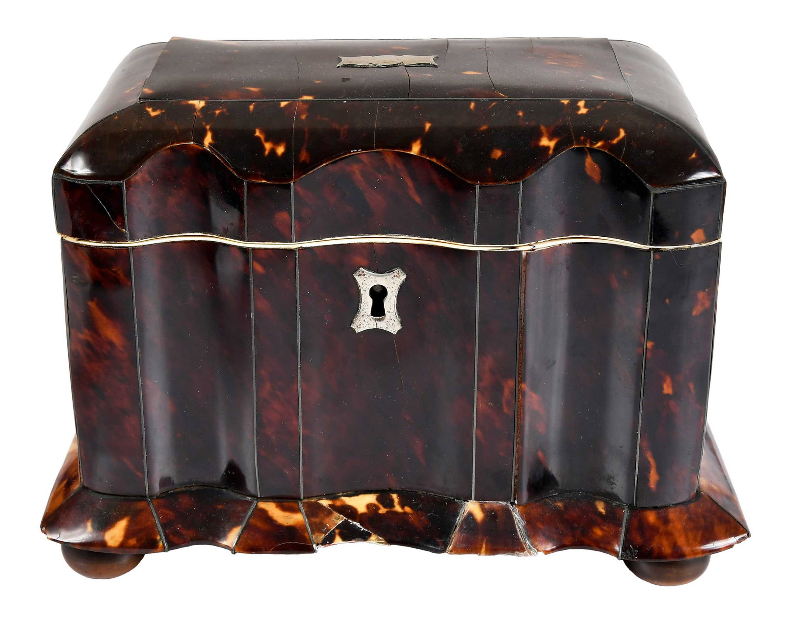 Regency Tortoiseshell and Ivory Tea Caddy: early 19th century, serpentine front, with purple velvet lined hinged lid opening to divided interior with ivory trim, inner lids with bone finials, on ball feet, silver plaque and escutcheon, 5 x 6-7