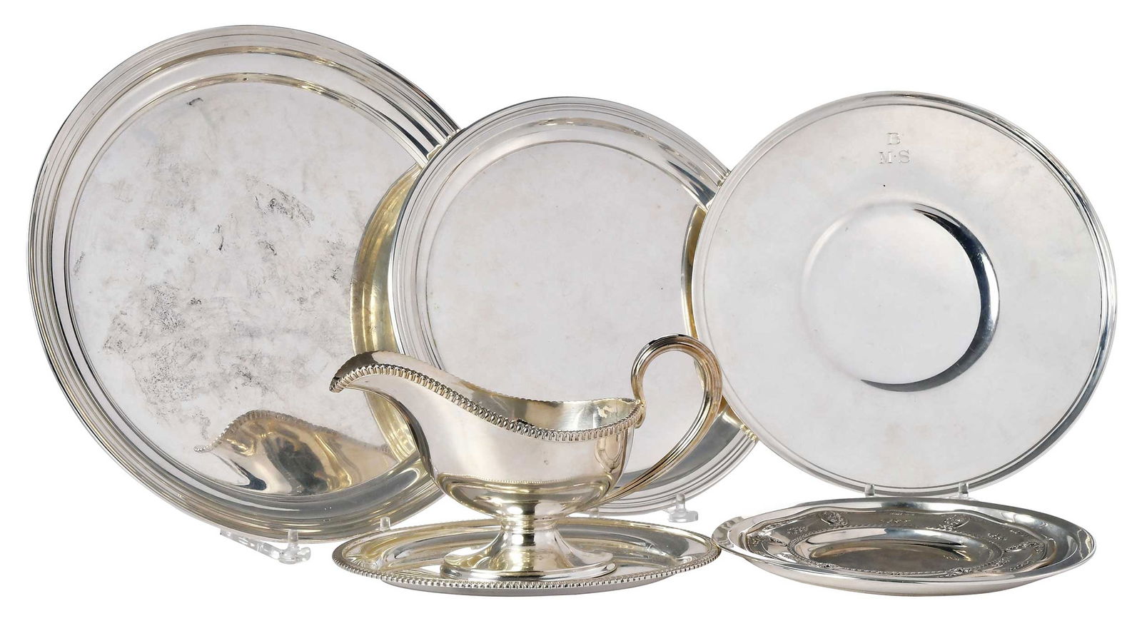 Five Sterling Table Items and Silver Plate Gravy Boat: Chicago Silver Co. footed cake plate; International, Lord Saybrook round tray; round Alvin tray; Wallace Rose Point small plate; small round tray, Lebkeucher & Co., most w
