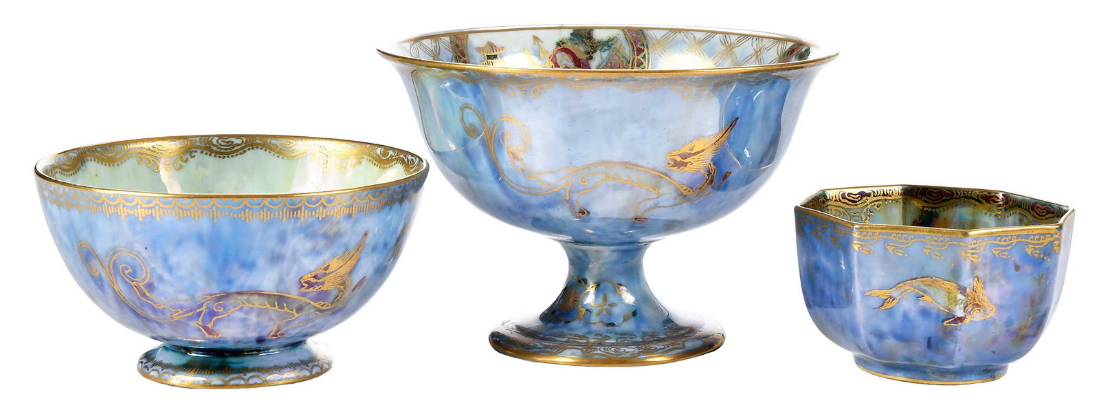 Three Wedgwood Fairyland Lustre Table Objects: British, first quarter 20th century, bases marked "Wedgwood, England", comprising: footed bowl exterior with chilongs and gilt border to rim and foot, interior with gilt scrollwork at rim centering ma
