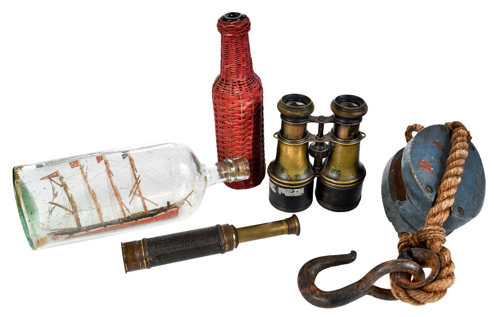 Five Nautical Decorative Objects: probably 19th century, comprising: ship model of a four masted British vessel flying multiple signal flags, in hand blown bottle, cork sealed with wax stamp depicting head in profile, 5 x 11 x 3 in.;
