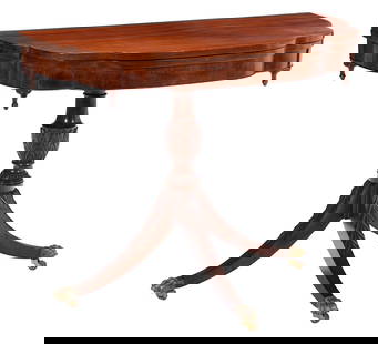 Classical Carved and Figured Mahogany 'Trick-Leg' Games Table: New York, circa 1815, attributed to Michael Allison (1773-1855), brass paw form casters, retains remnant of repair label of Ernest Hagen, 30-1/4 x 36-1/4 x 18 in., opens to 36 in. Provenance: Christie