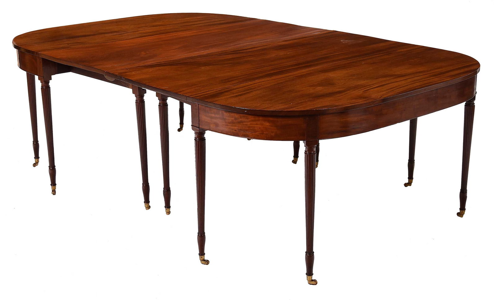 Federal Figured Mahogany Two Part Dining Table: New York, circa 1815, attributed to Duncan Phyfe (1768-1854), white pine and maple secondary, brass casters, 28-1/2 x 56-1/2 x 87-5/8 in., together with a reproduction six leg drop leaf table, opens t