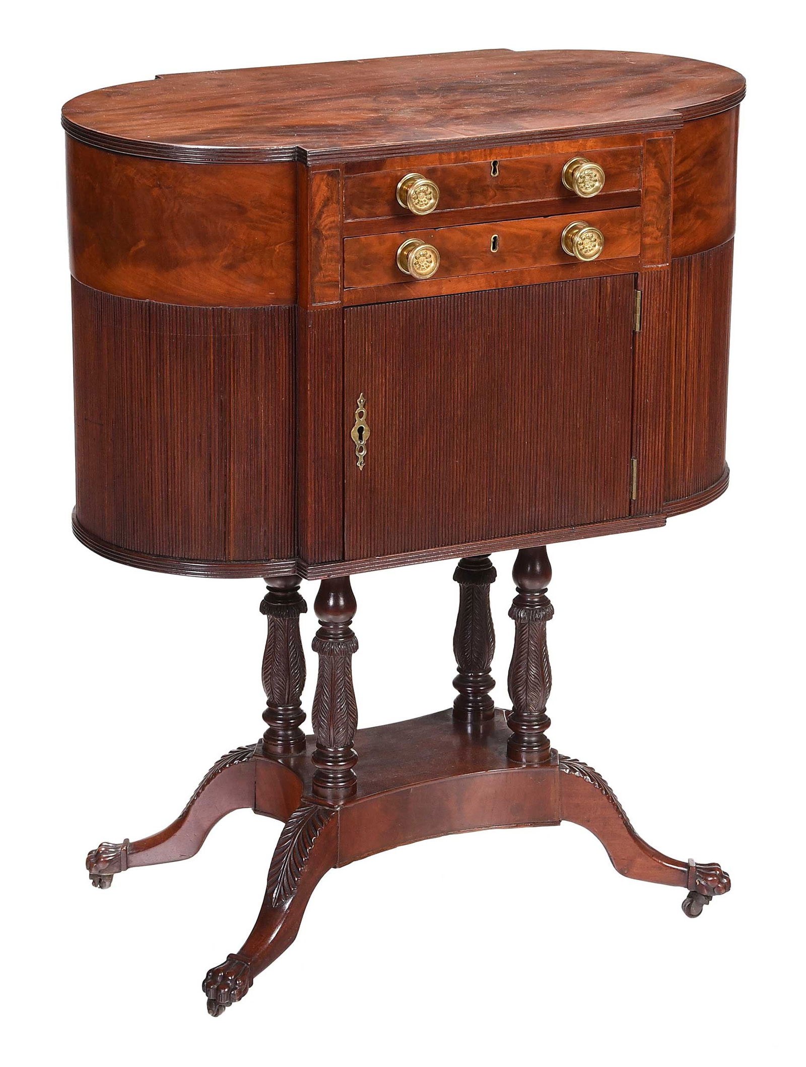Fine Classical Carved and Figured Mahogany Work Table: New York, circa 1815, attributed to the school of Duncan Phyfe, poplar secondary, with fitted writing desk interior, carved paw form feet on casters, legs and columns with acanthus motif, 31-1/4 x 25-