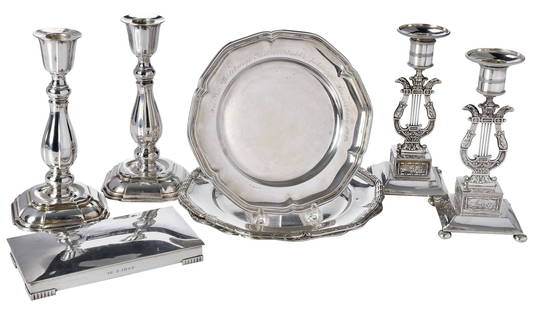 Eight Swedish Silver Table Items: late 19th/20th century, including pair of plates, reed and ribbon borders, inscription on backs; pair of candlesticks with lyre form bases; plate with scalloped border, 1925 inscription; pair of candl