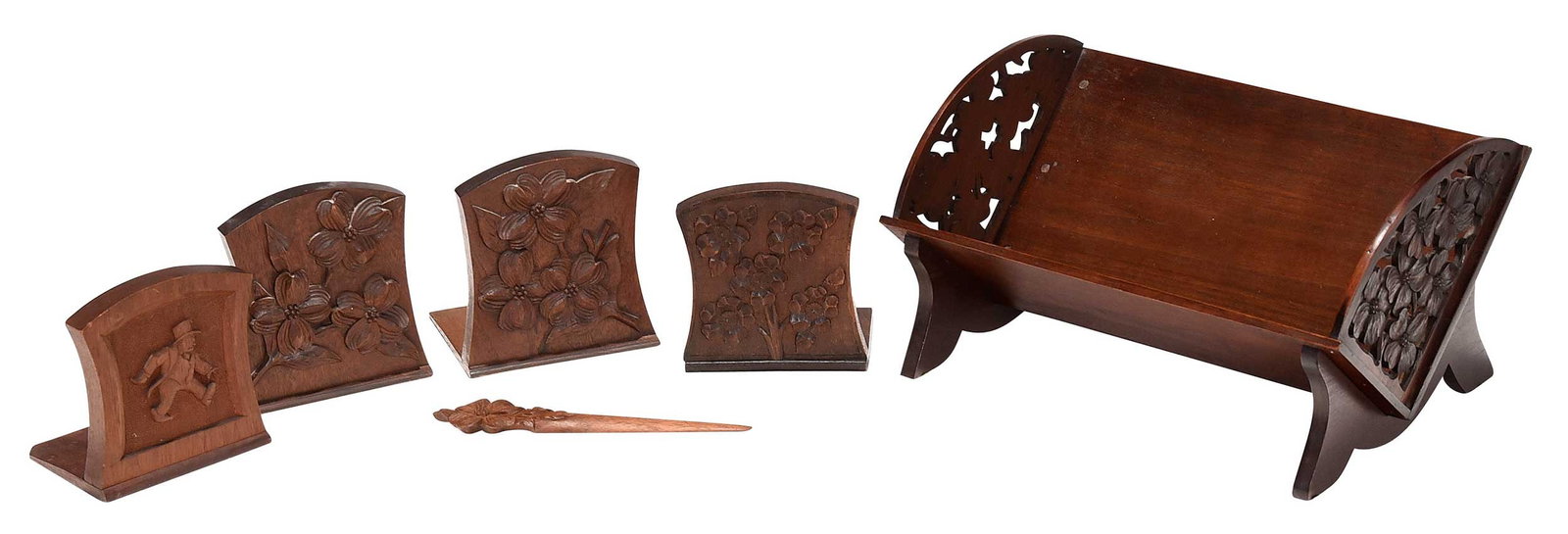 Six Biltmore Industries Carved Wood Objects: North Carolina, early 20th century, two with marks for Biltmore Industries, comprising: openwork book stand; four bookends; letter opener; largest 7 x 14 x 9 in. Provenance: Private Collection, Ashevi