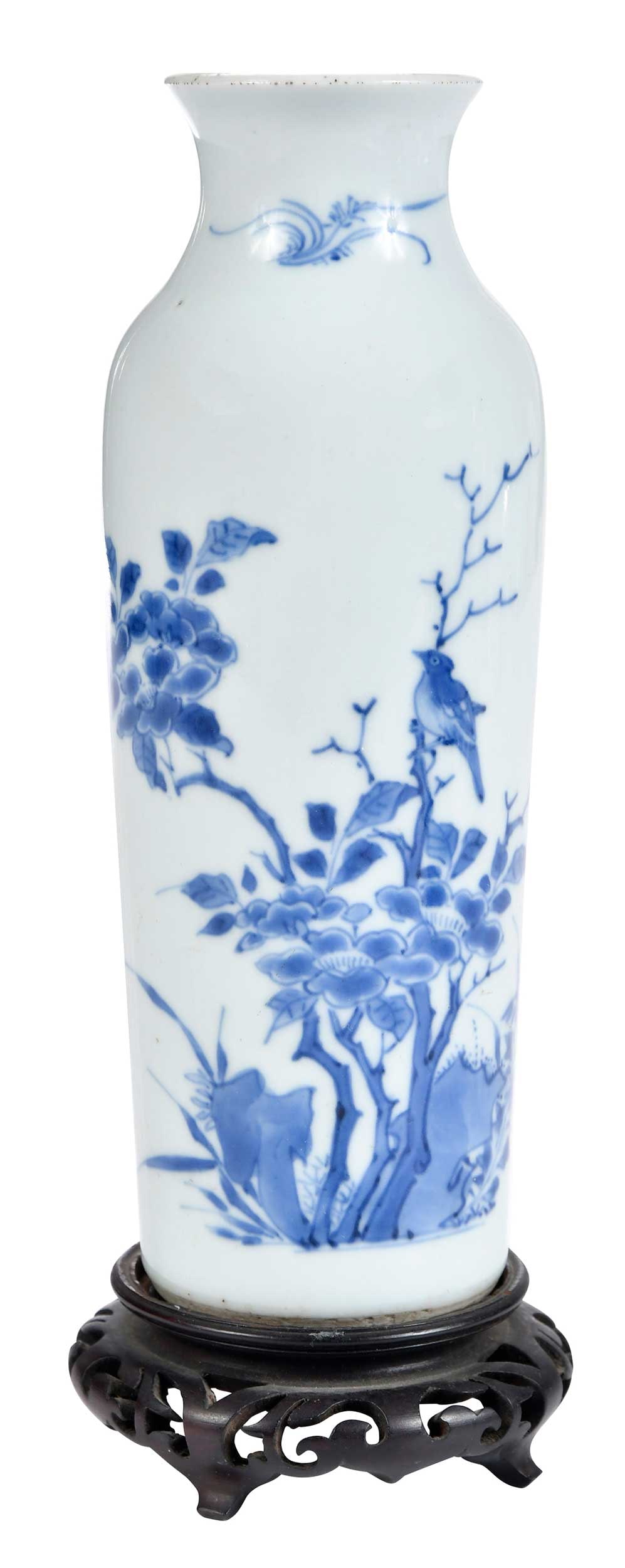 Chinese Blue and White Porcelain Vase with Stand: 19th century, in underglaze blue decoration of blossoming branches, rocky outcroppings, and birds, 8-1/8 x 3 in.; carved wood stand, 1-3/8 x 3-1/2 in. Provenance: Dr. Stanley Sherman Burns, St. Louis,