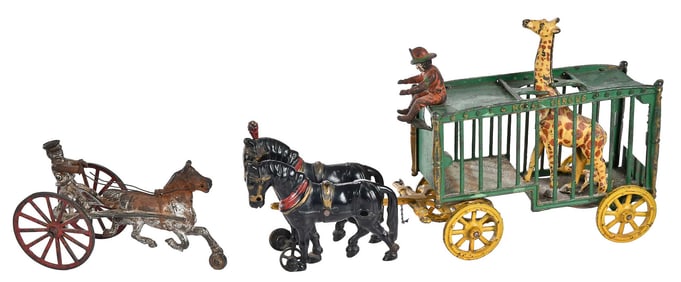 Two Cast Iron Horse-Drawn Toys, One with Circus Wagon