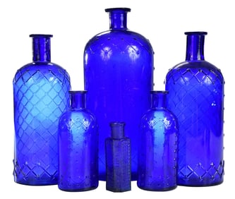 Six Cobalt Blue Glass Poison Bottles of Various Sizes