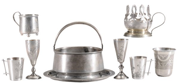 Eight Pieces Russian Silver: late 19th/20th century: round basket with floral engraving, marks for Ivan Alexeyev, 4-1/2 x 4 in., [wear, dents,] with unmarked silver-plated under plate; two similar goblet-form vodka cups, gilt int