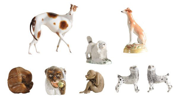 Eight Bisque and Pottery Animal: Figures 20th century, including a seated Staffordshire whippet; a prancing Afghan, a seated monkey with glass eyes; a carved wooden monkey hiding eyes; monkey with apple toothpick holder; a German poo