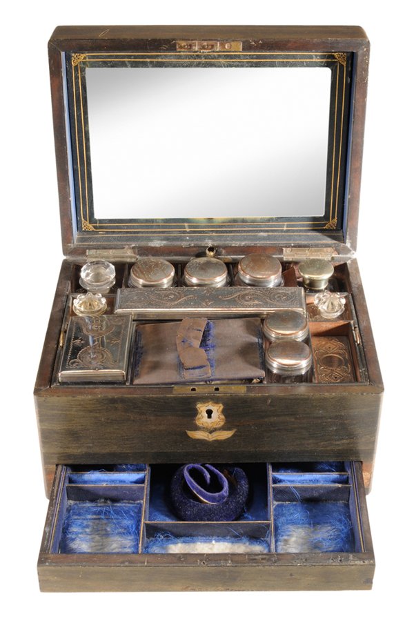 Rosewood Traveling Toilette Case: English, mid 19th century, rectangular case with inlaid mother-of-pearl cartouche on top, opening to a fully appointed interior containing a desk compartment in the lid, lift-top drawer with cut cryst