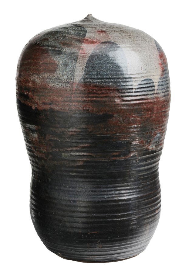Toshiko Takaezu: (Hawaii, 1922-2011) Monumental stoneware moon vase, runny red, blue and black glazes on pronounced ring-turned surface, base signed with glaze "TT", 24 in., excellent condition Provenance: Collection