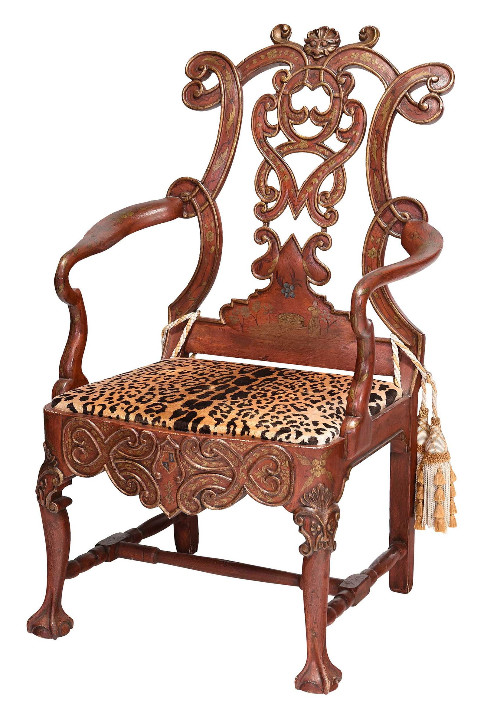 Chinese Style Carved and Paint Decorated Armchair with Faux Animal Print Upholstery: 20th century, with metal tag for "Charles Pollock Reproductions, Los Angeles", open work back with central mask, the carved skirt with central heraldic shield, 45-1/2 x 29 x 22-1/2 in. Prove