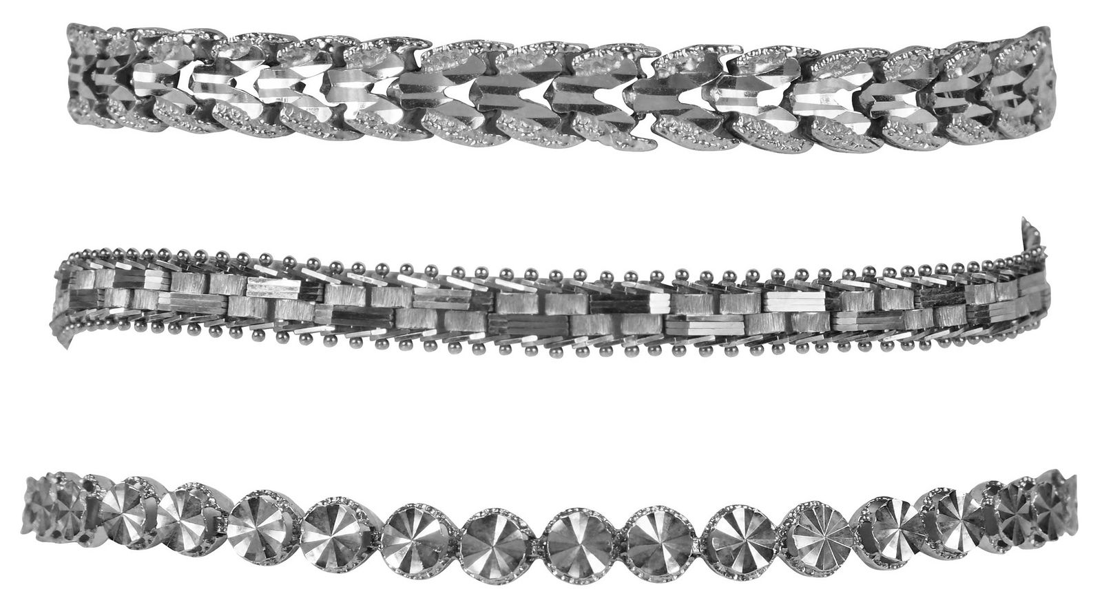 Three 14kt. Fancy Link Bracelets: comprising: diamond cut finish, stamped "14K", yellow gold, two are 8 in. length, one 7 in. length, hidden box clasps with safety latch; total weight 34.7 g Provenance: Private Collection Note: Brunk