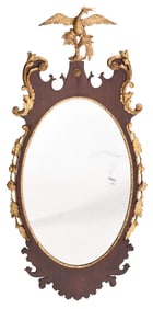 A Fine Chippendale Carved and Parcel Gilt Mahogany Oval Mirror