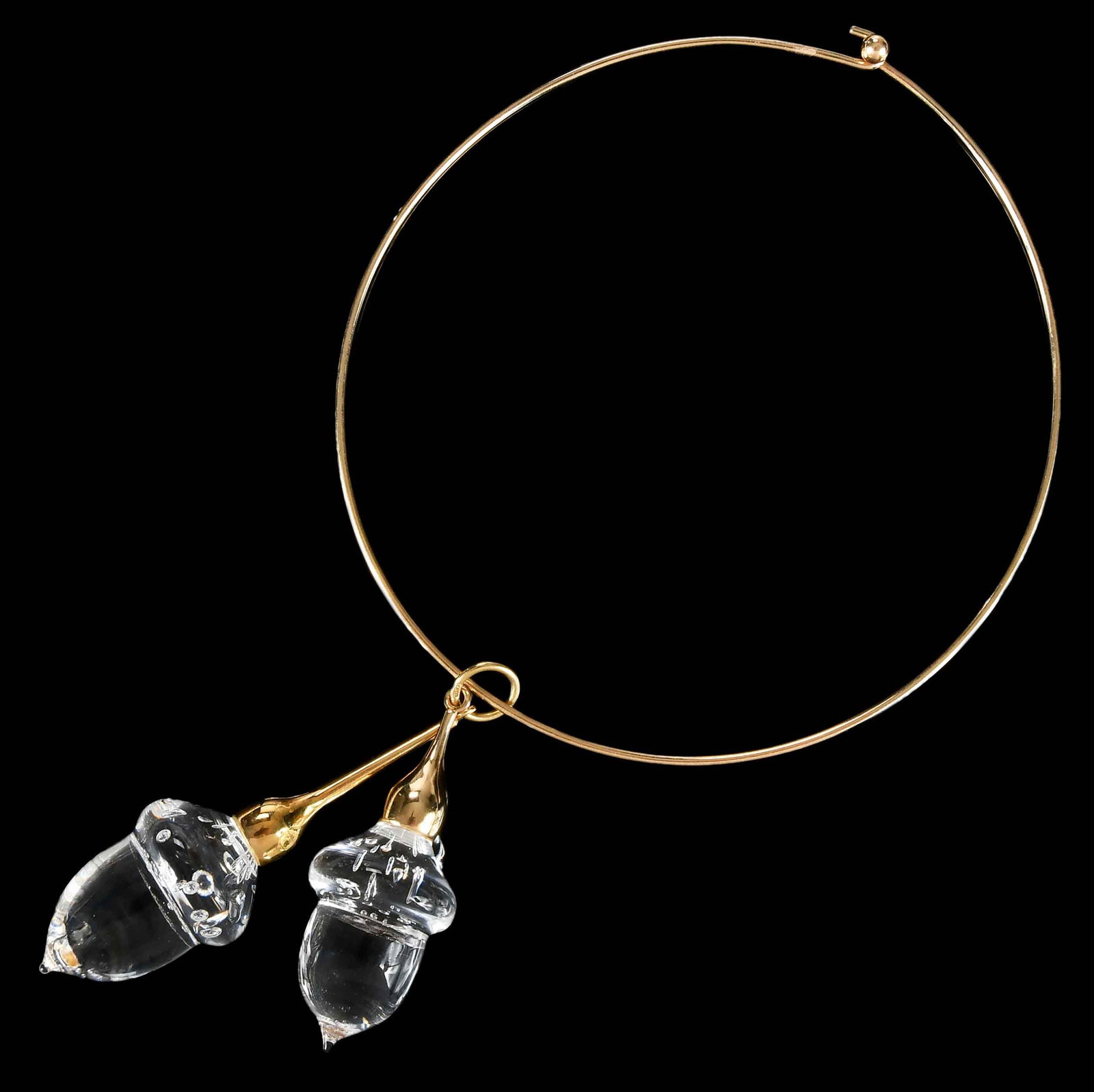 18kt. Steuben Glass Acorn Collar Necklace: two glass acorns, by Paul Schulze for Steuben Glass, signed by designer, stamped "18kt", yellow gold, approx 3-1/2 in. drop suspended from a wire choker necklace, tests 14kt. yellow gold, approx. 15 i