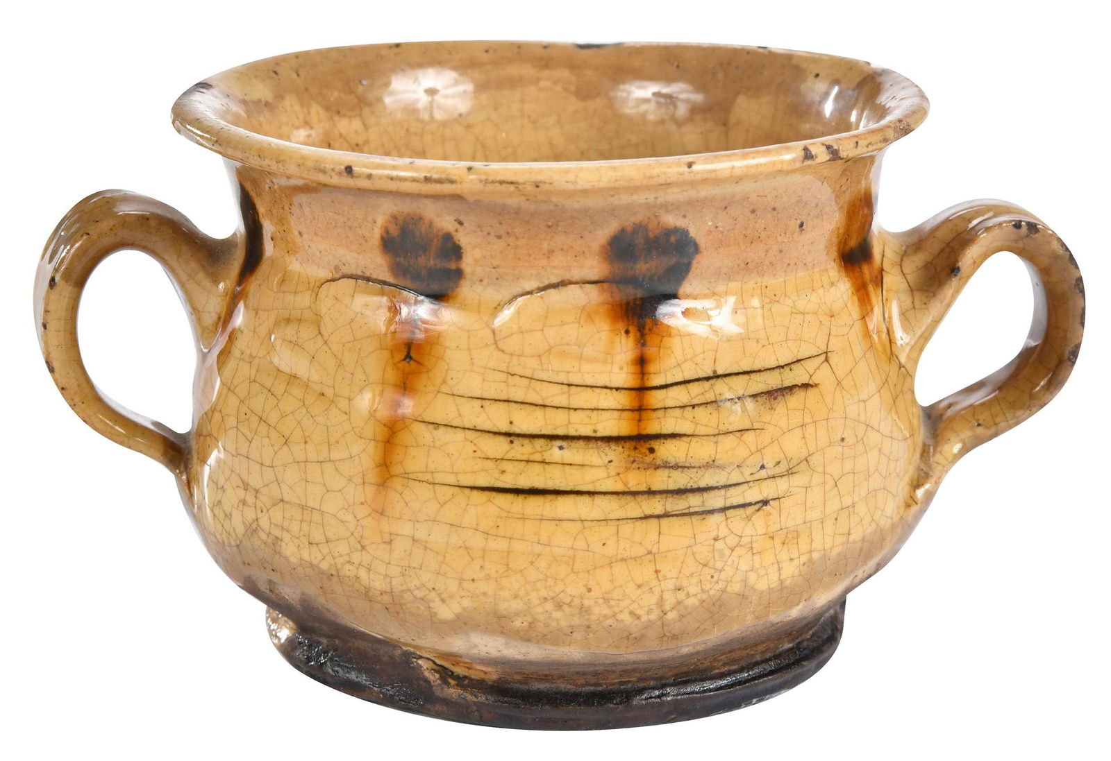 English Slipware Double-Handled Posset Cup: 18th century, cream ground with dark brown dotted decoration, 3-1/2 x 6-1/2 x 5 in. Provenance: Hollis E. Brodrick of Portsmouth, New Hampshire, in January 1997; Tonnesen Collection, New Hampshire Lit