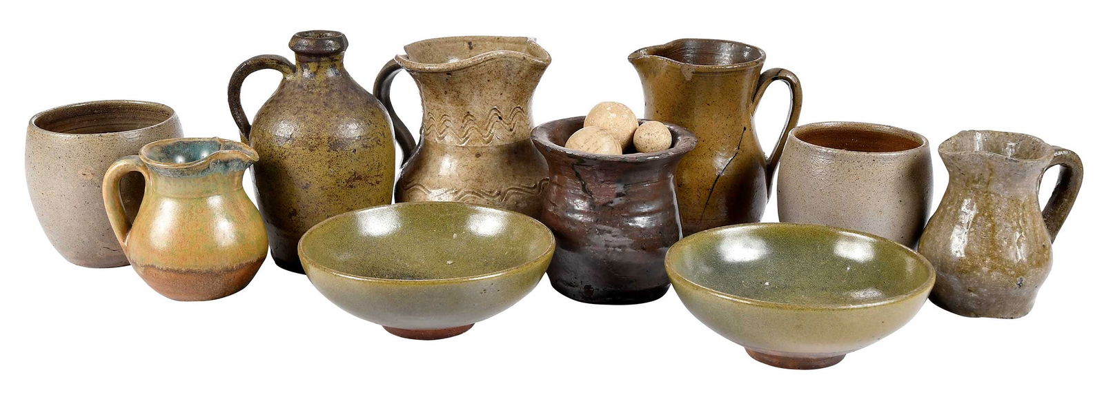 Ten Small Pieces Of Southern Pottery Tablewares and Ten Clay Stone Marbles: two olive green glazed footed bowls stamped "BEN OWEN MASTER POTTER", 1-1/2 x 4-1/2 in.; two salt glazed cups stamped "JUGTOWN WARE" on base, 3 in. creamer with incised wavy line decoration, speckled