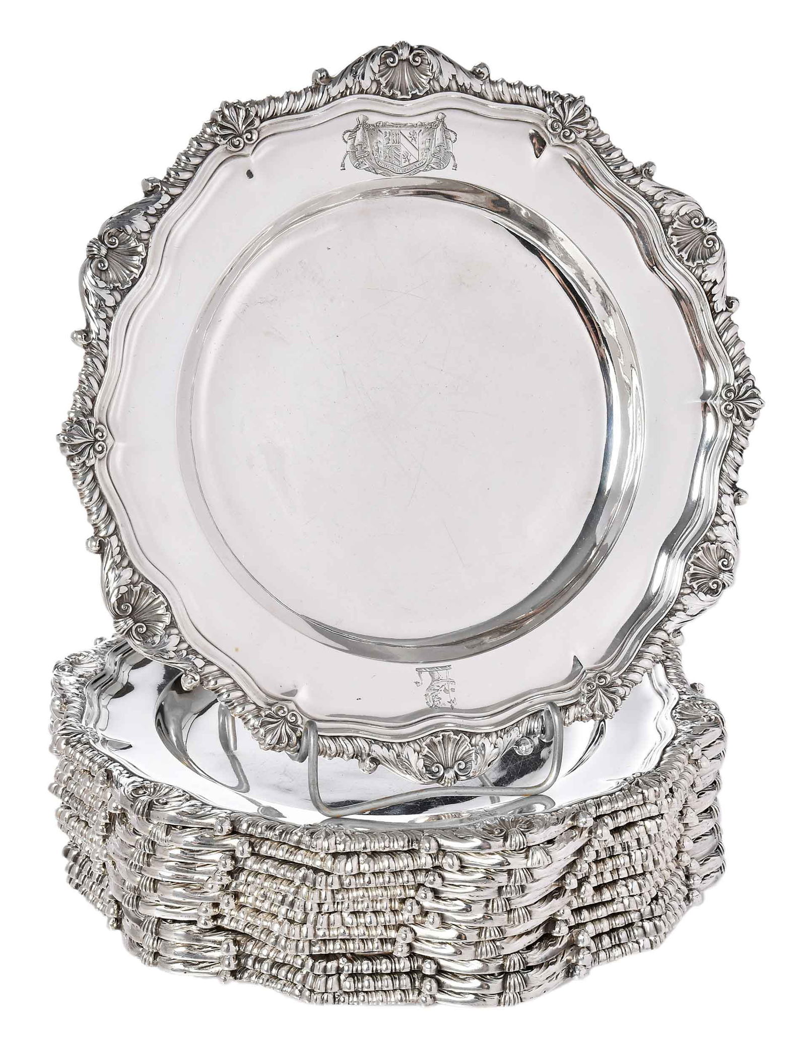 Set of 12 George III English Silver Dinner Plates, William Bennett: London, 1812, round with gadroon, shell, foliate, and palmette rims, engraved with arms on drapery mantle and with crest, marks for William Bennett, .925 fine, 368.23 oz. T., 10-1/2 in. Provenance: Ch