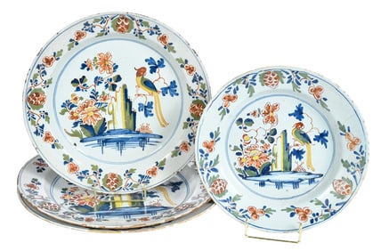 Four English Delft Polychrome Parrot Chargers and Plate