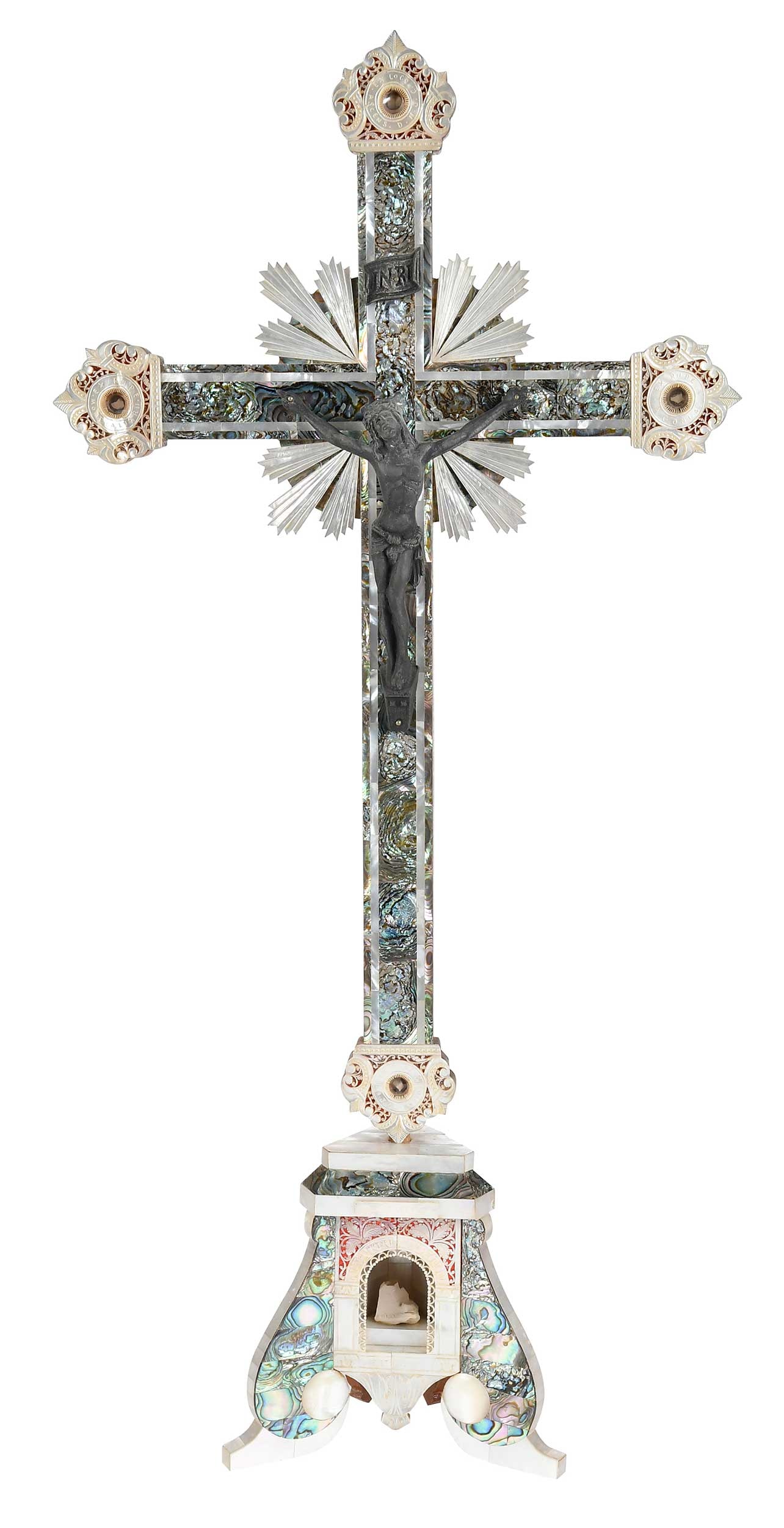 Mother of Pearl Veneered Reliquary Altar Crucifix: Bethlehem, mid-20th century, olivewood construction with mother of pearl and abalone veneers, stone relics from the Church of the Nativity (niche in stand), Tomb of Christ at the Holy Sepulchre (botto