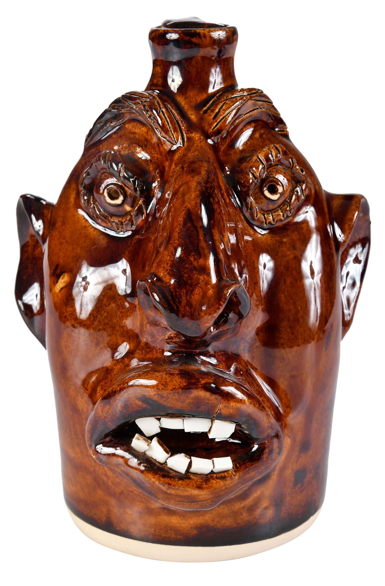 Charlie Brown Pottery Face Jug: Arden, North Carolina, 2012, light brown glaze, signed and dated verso and base "...8-8-12/Charlie Brown", 8-1/2 x 5-3/4 x 5-5/8 in. Provenance: Property from the Collection of Ted and Ann Oliver