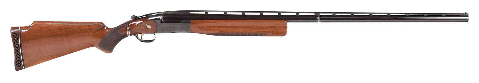 Browning BT 99 Single Shot Trap Shotgun: serial number 01075PM199, 12 gauge, 34 in. barrel with full vented rib, white bead mid and front sight, IM bore, light scroll engraving to blued receiver, gold plated trigger, walnut Monte Carlo style